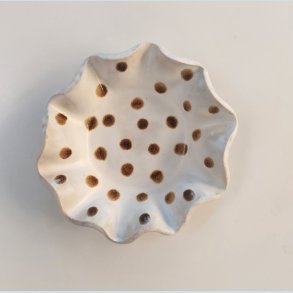 Fyrfadsstager med brune prikker