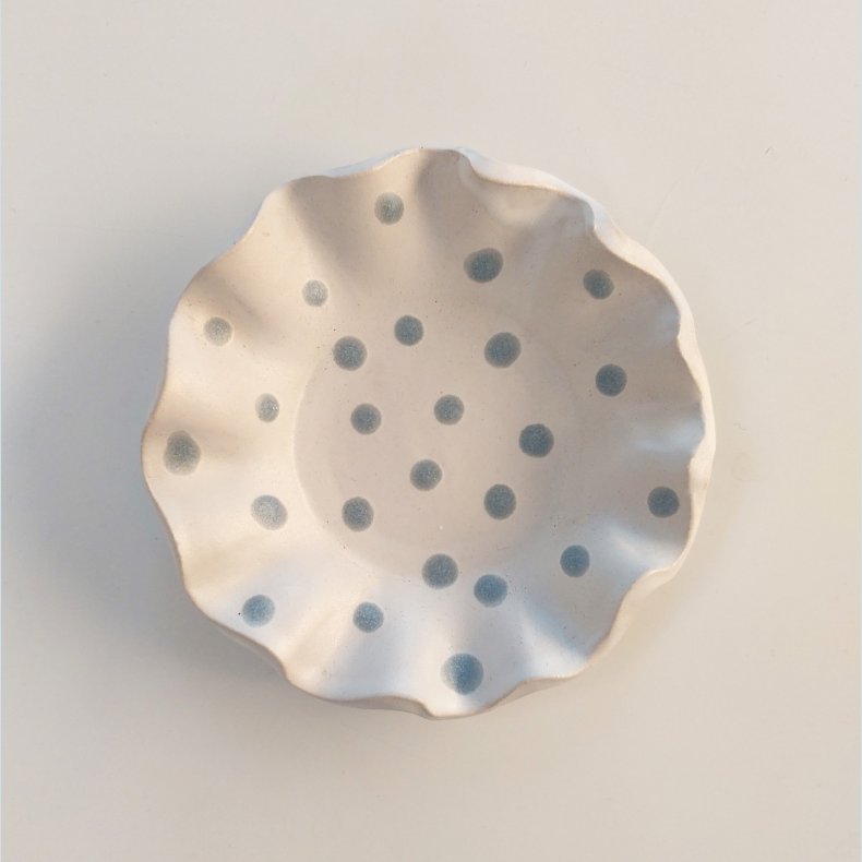 Fyrfadsstage med bl� prikker